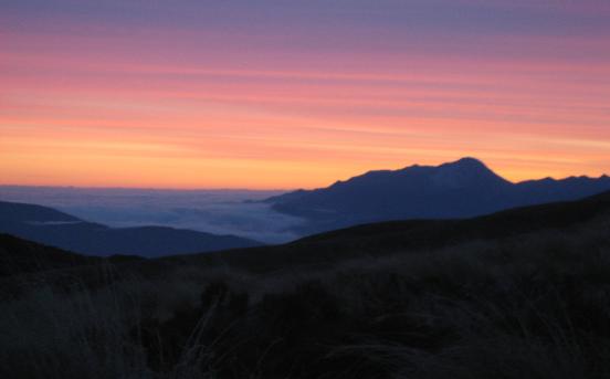 Sunset over the Kepler Mountains with clouds blanketing the lowlands