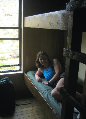 Robin tests out her bottom bunk at Luxmore hut